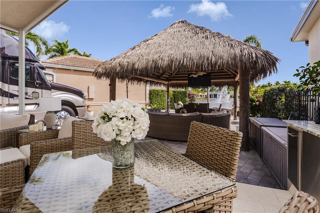 13410 Snook Circle Naples, FL 34114 - Photo 11 of 50 a view of an outdoor sitting area with furniture