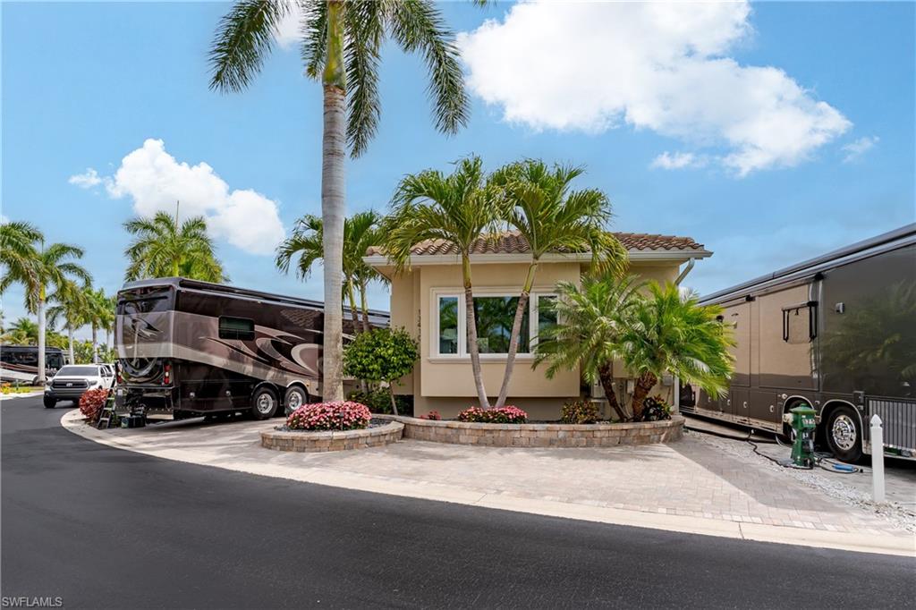 13410 Snook Circle Naples, FL 34114 - Photo 2 of 50 a view of a street with cars