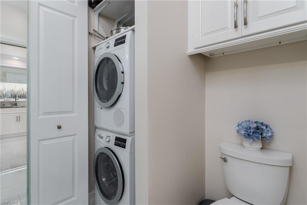 13410 Snook Circle Naples, FL 34114 - Photo 21 of 50 a utility room with dryer and washer