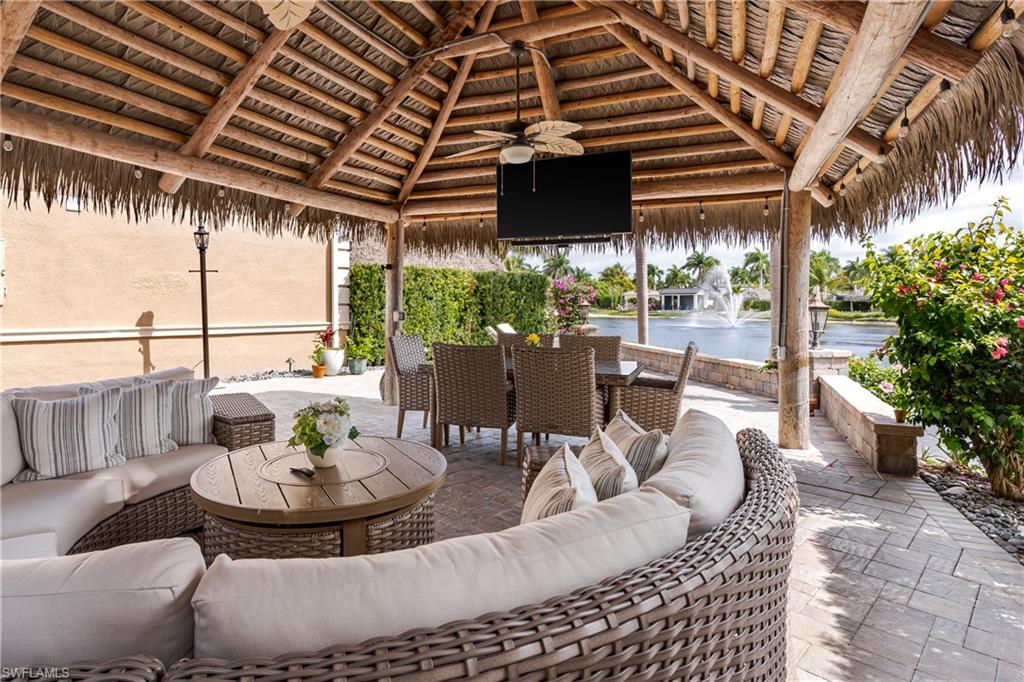 13410 Snook Circle Naples, FL 34114 - Photo 23 of 50 a view of a patio with couches and potted plants