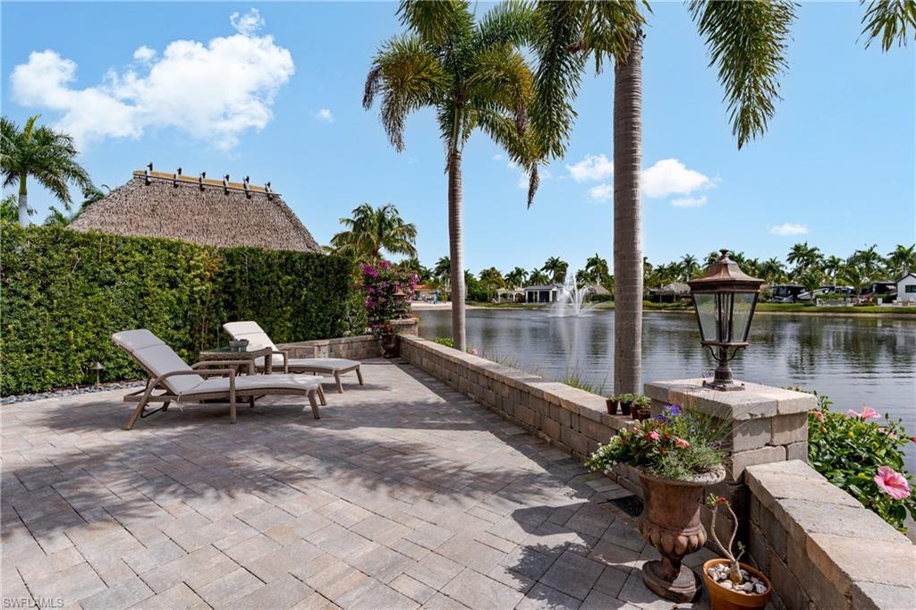 13410 Snook Circle Naples, FL 34114 - Photo 27 of 50 a view of a lake with a table and chairs