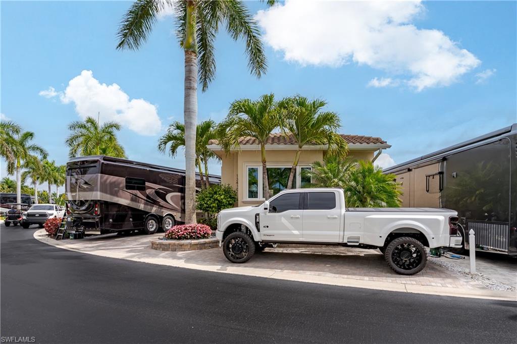 13410 Snook Circle Naples, FL 34114 - Photo 3 of 50 a view of a cars parked in front of a house