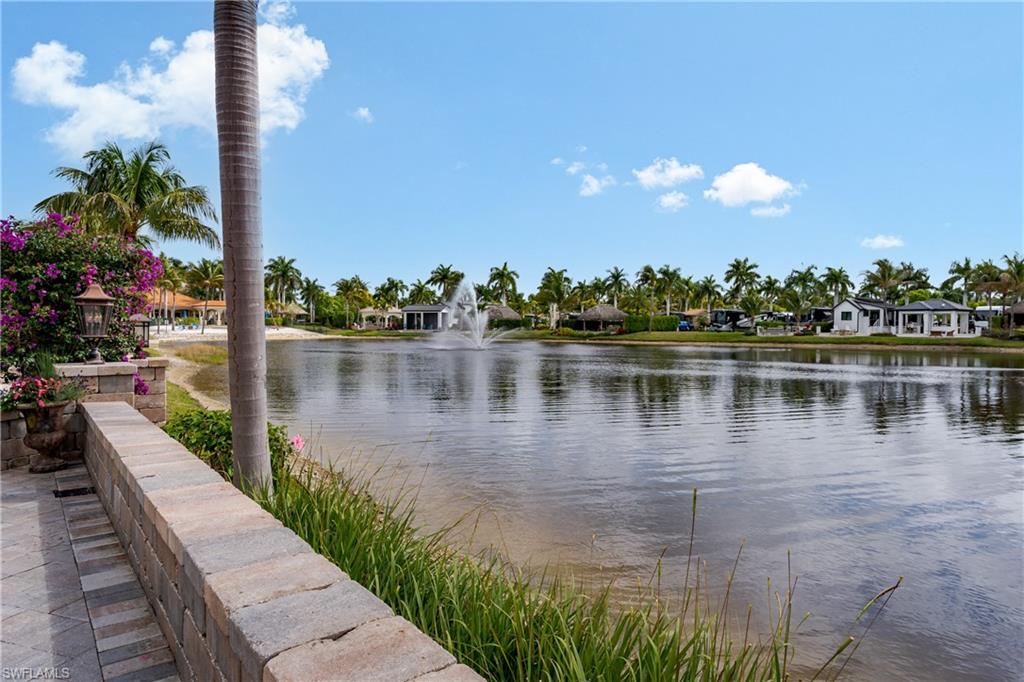 13410 Snook Circle Naples, FL 34114 - Photo 33 of 50 a view of a lake with a mountain view