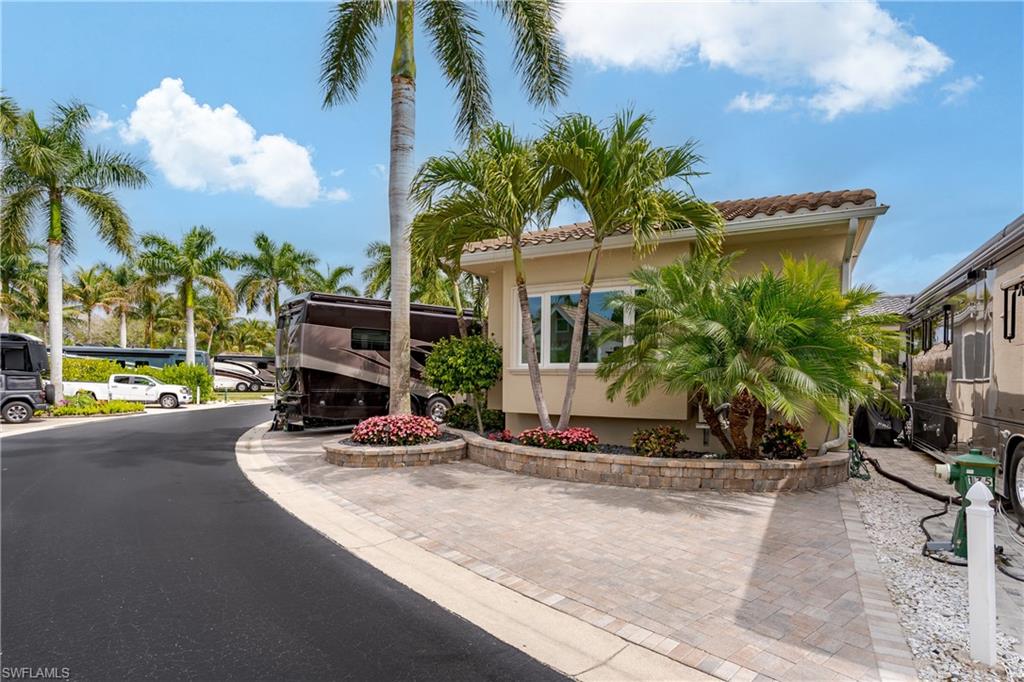13410 Snook Circle Naples, FL 34114 - Photo 35 of 50 a view of a house with a patio