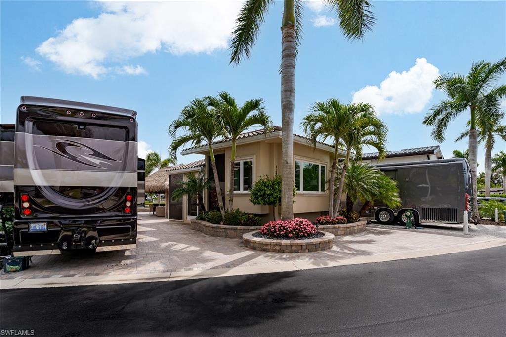 13410 Snook Circle Naples, FL 34114 - Photo 36 of 50 a view of a car park in front of house