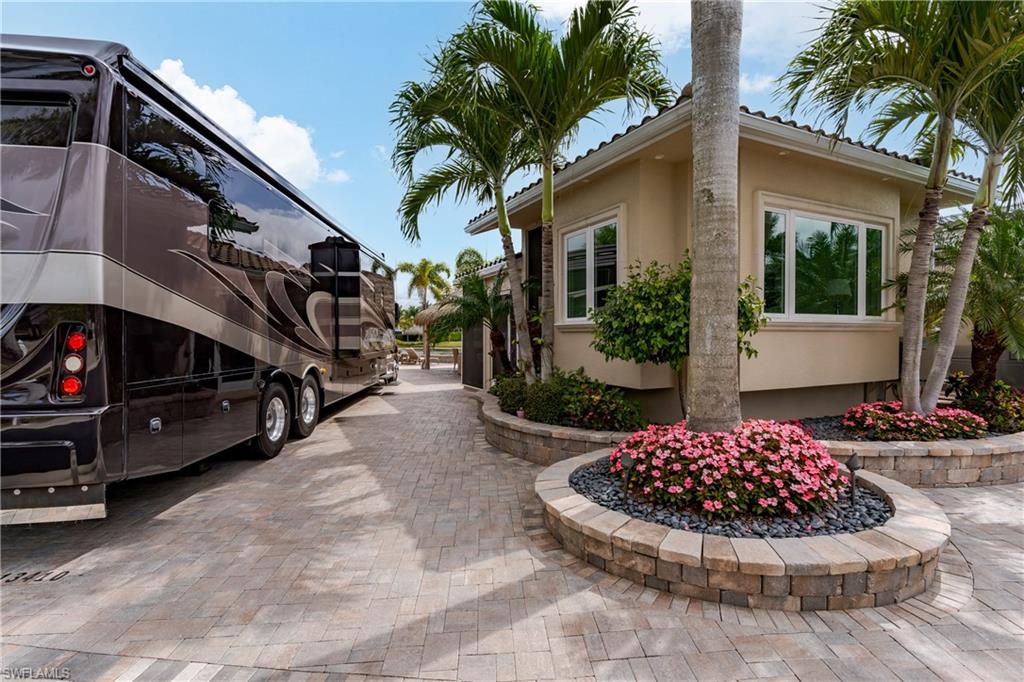 13410 Snook Circle Naples, FL 34114 - Photo 37 of 50 a view of a house with backyard and sitting area