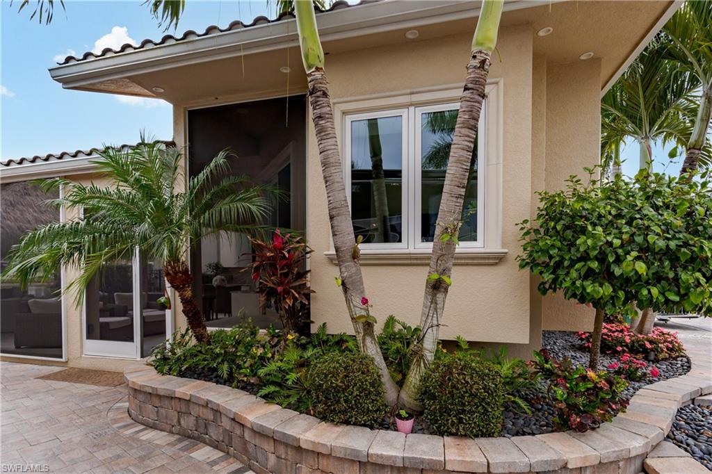 13410 Snook Circle Naples, FL 34114 - Photo 5 of 50 front view of a house with a porch
