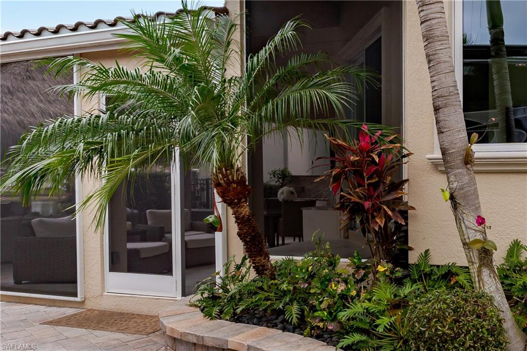 13410 Snook Circle Naples, FL 34114 - Photo 7 of 50 a plant is in front of a house