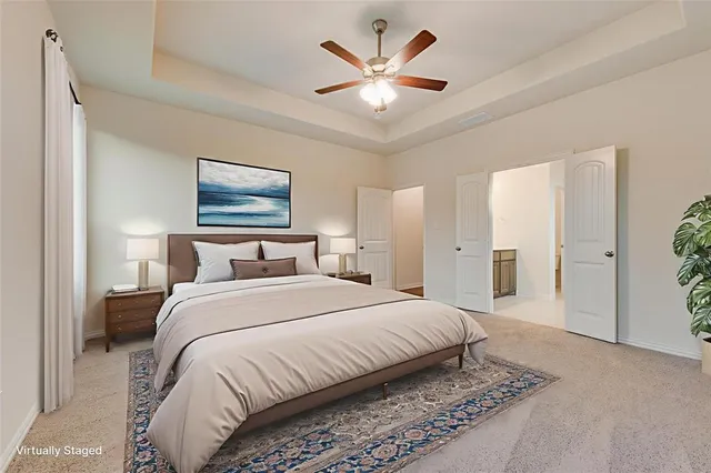 a spacious bedroom with a large bed a chandelier and closet