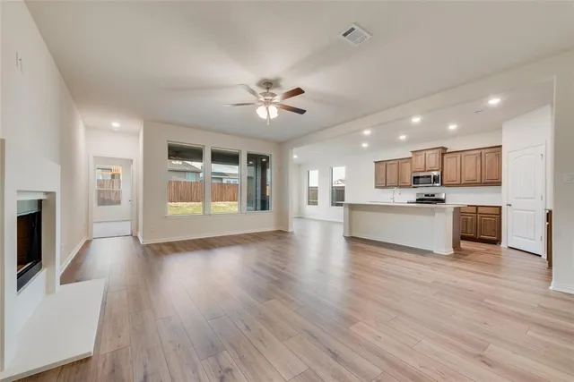 a view of kitchen with cabinets and wooden floor