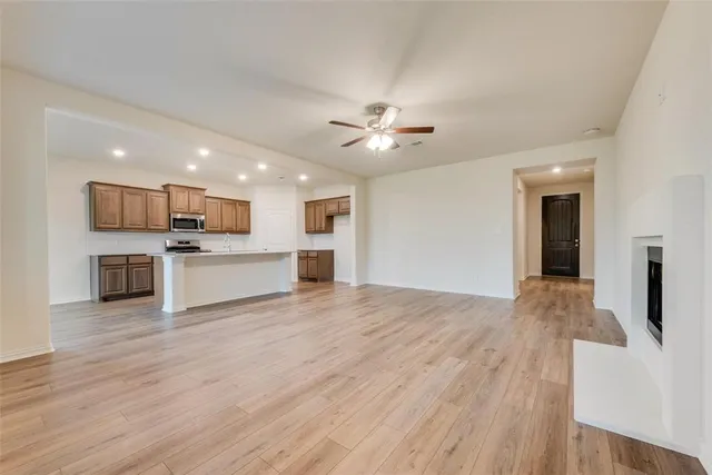 a view of kitchen with cabinets and wooden floor