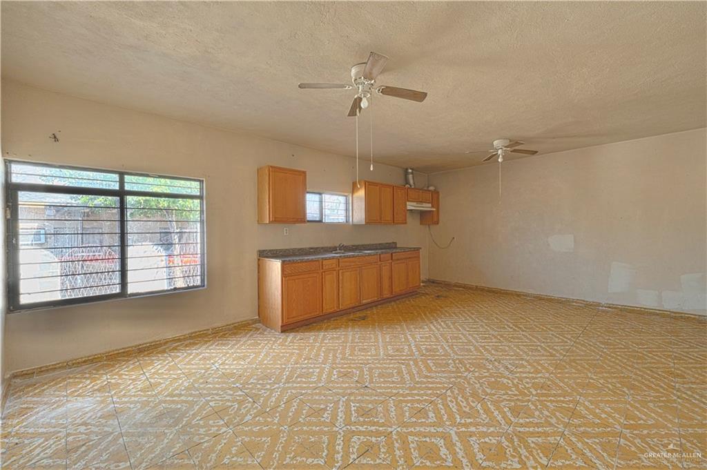 1106 Estrella Street Roma, TX 78584 - Photo 3 of 13 a view of a kitchen with a sink and a window
