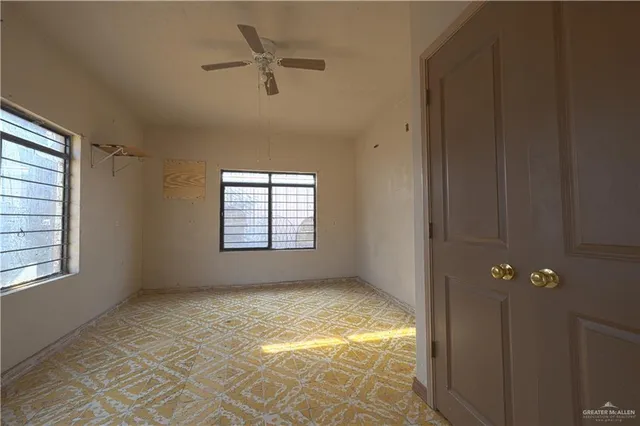 a view of an empty room with a window