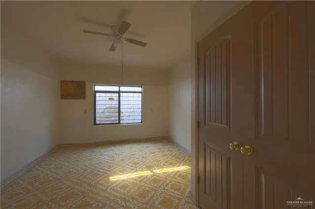 a view of an empty room and window