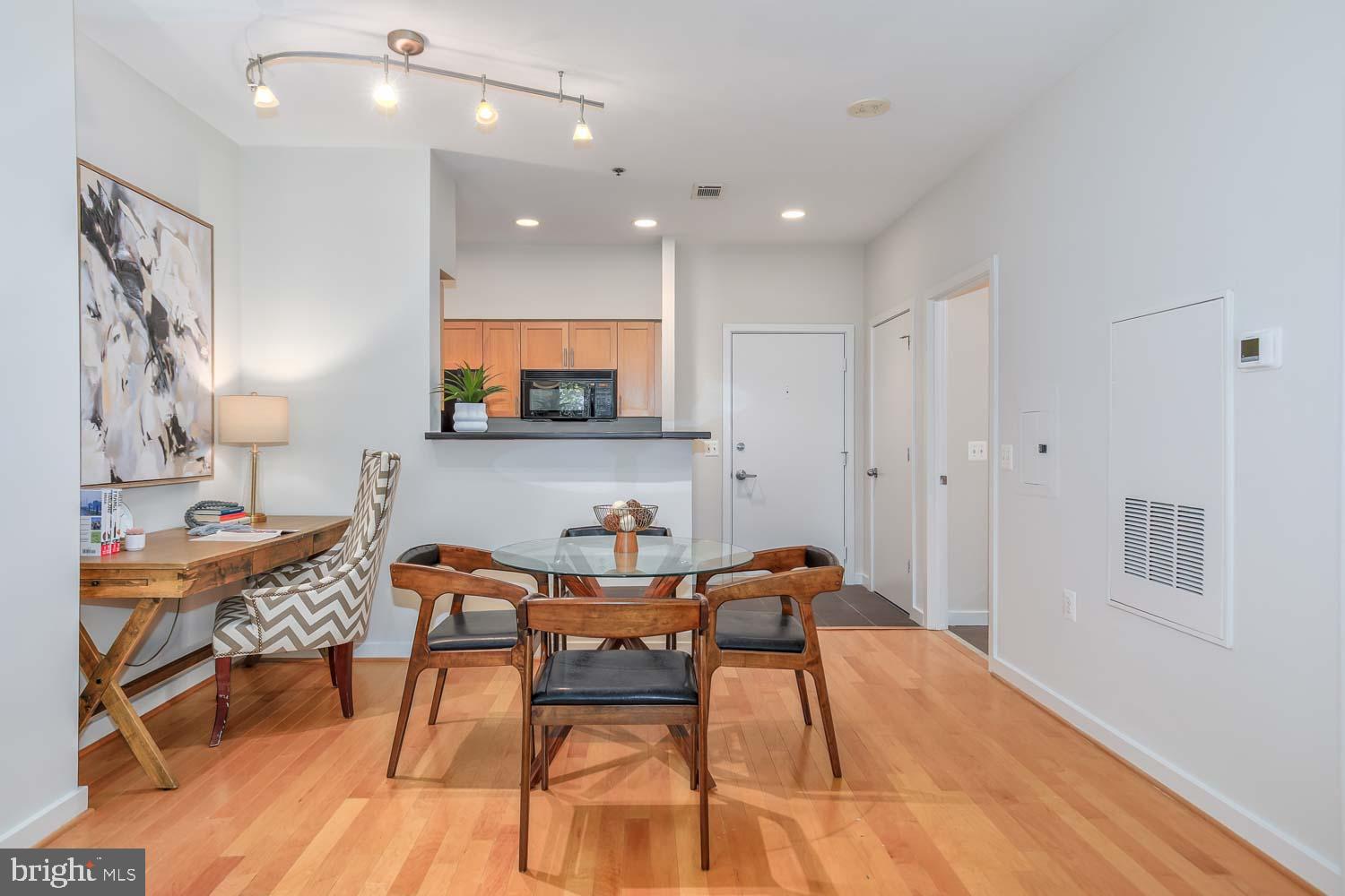 3883 Connecticut Avenue Northwest, Unit T3 Washington, DC 20008 - Photo 11 of 25 a view of a dining room with furniture and wooden floor