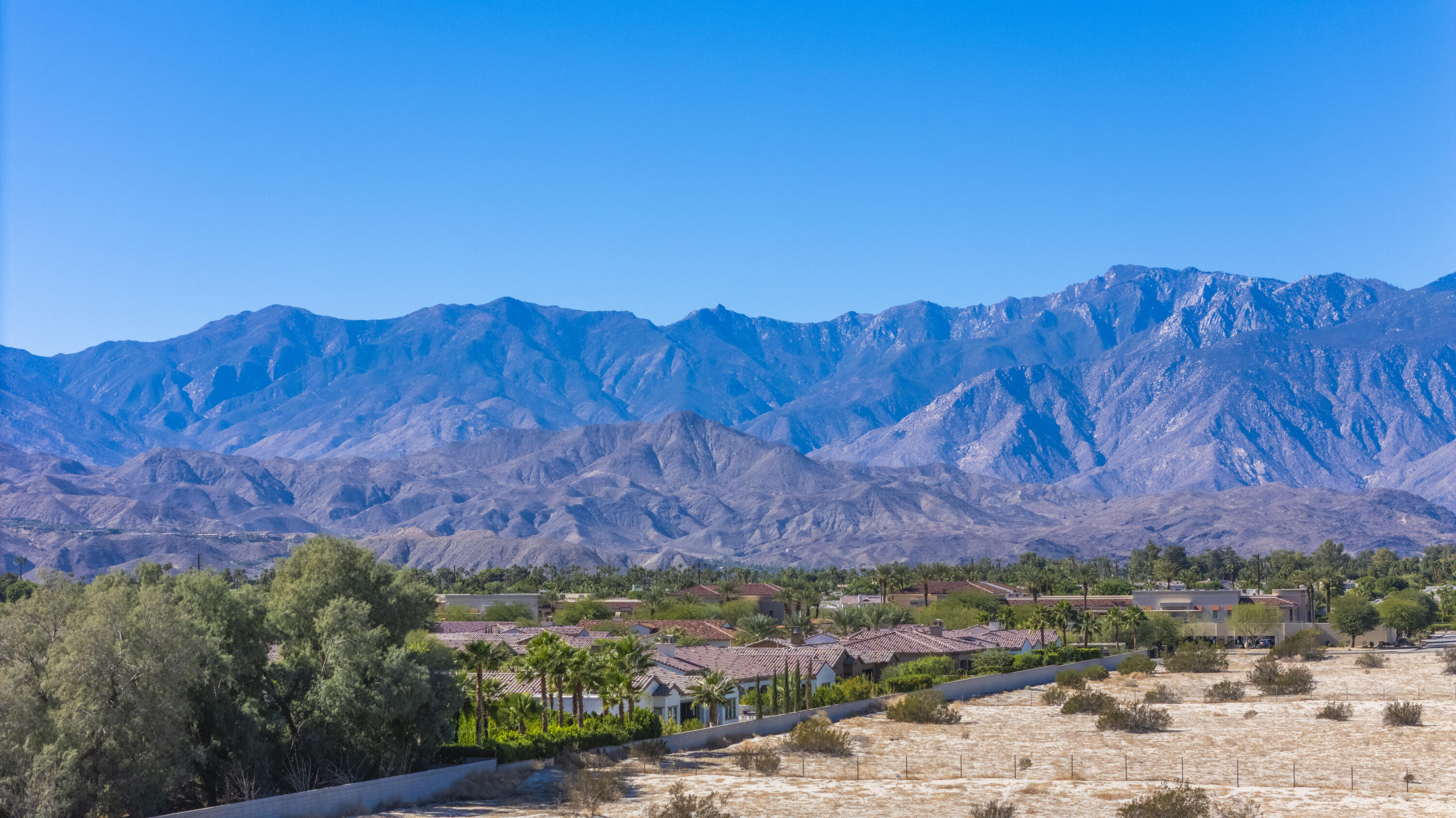 35335 Via Josefina Rancho Mirage, CA 92270 - Photo 20 of 24 a view of a backyard with wooden fence