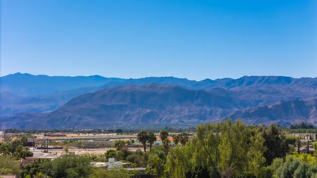 a view of a city with mountains in the background