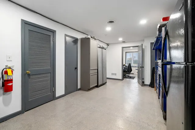 a room with furniture and gym equipment