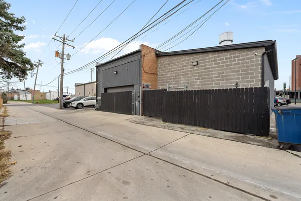 a front view of a building with a yard and garage