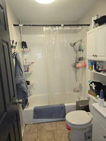 a kitchen with granite countertop a sink stainless steel appliances and cabinets