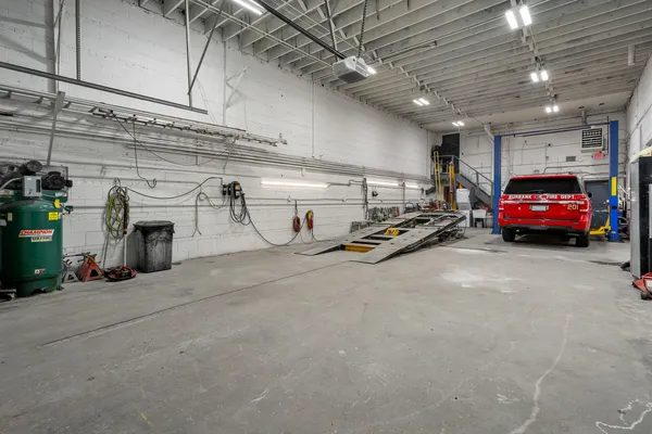 a view of parking garage with cars