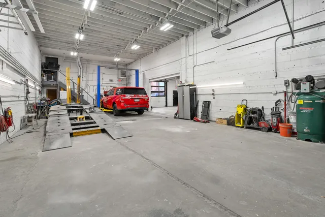 a view of parking garage with cars