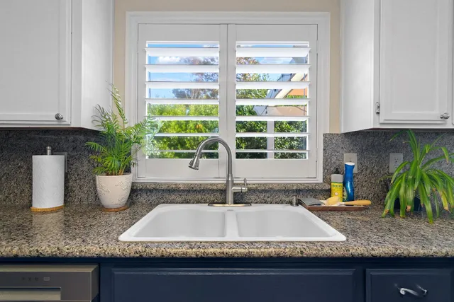 a kitchen with sink and window