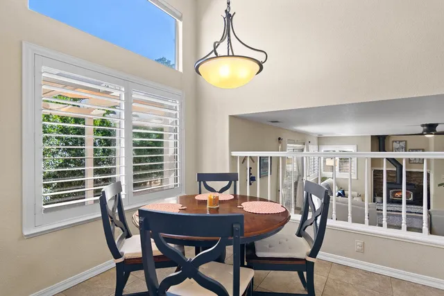 a view of a dining room with furniture and window
