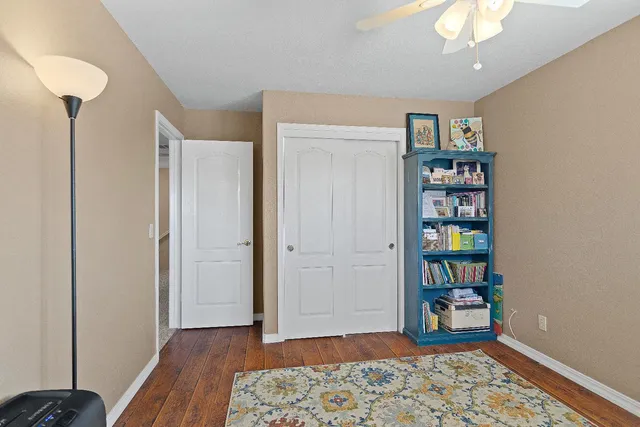 a view of room with window and wooden floor