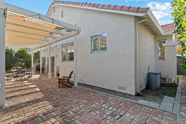 a view of a patio with a table and chairs in patio