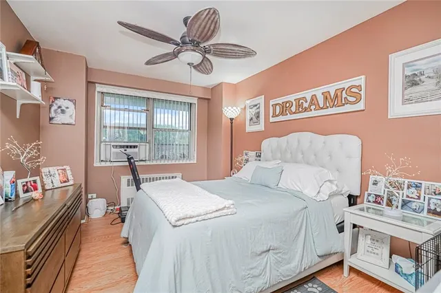 a bed room with a bed and a chandelier