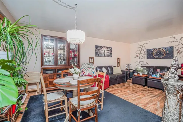 a dining room with furniture and a chandelier