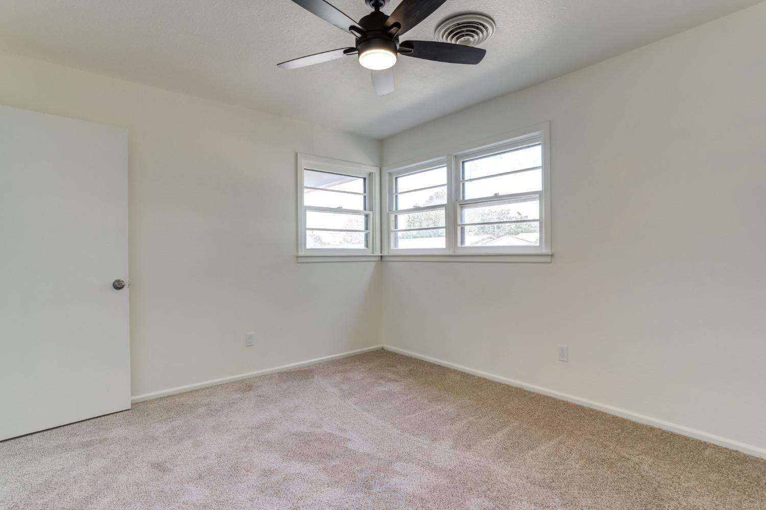 2119 67th Street Lubbock, TX 79412 - Photo 27 of 42 a view of an empty room with a window