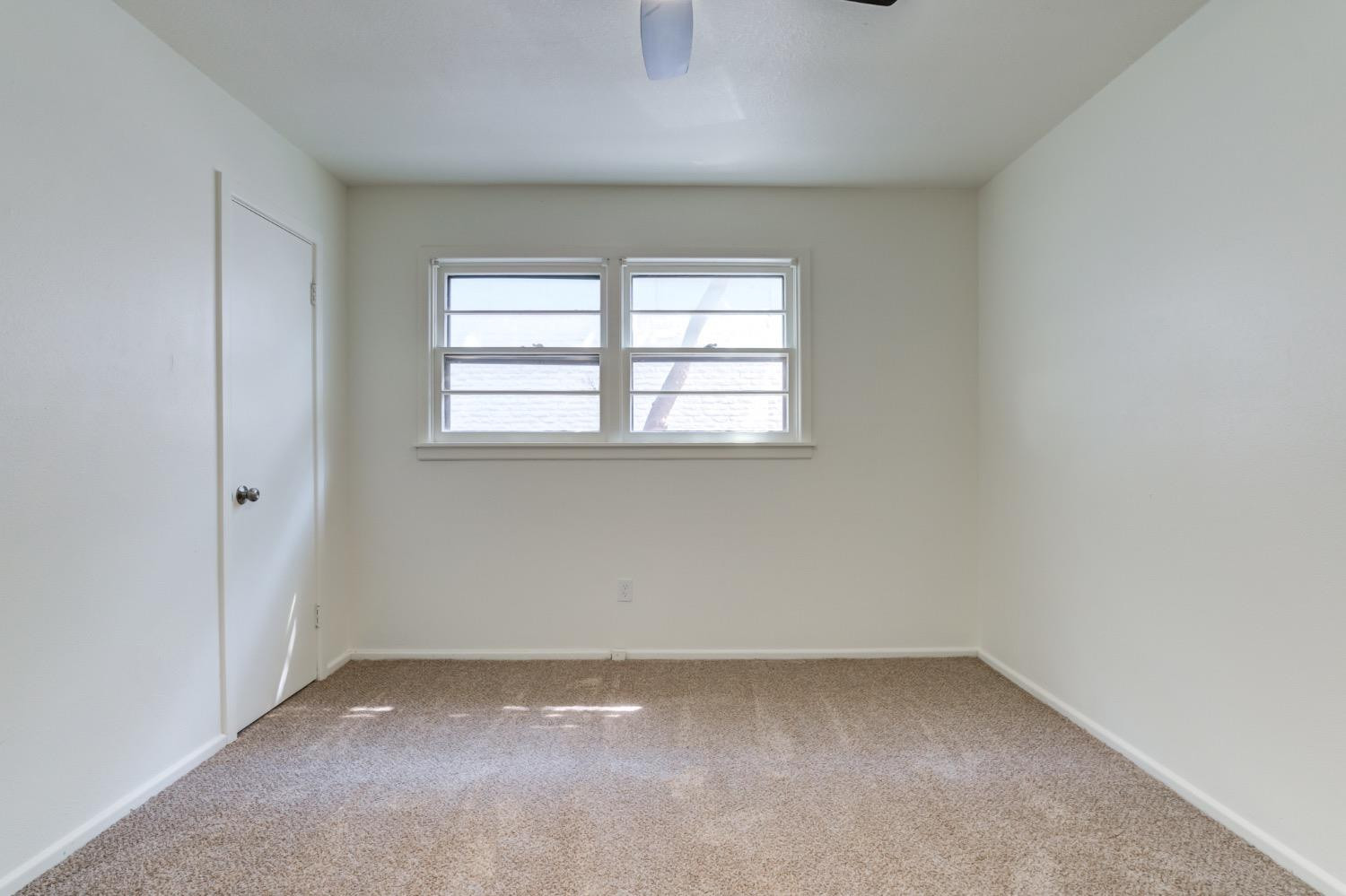 2119 67th Street Lubbock, TX 79412 - Photo 29 of 42 an empty room with a window