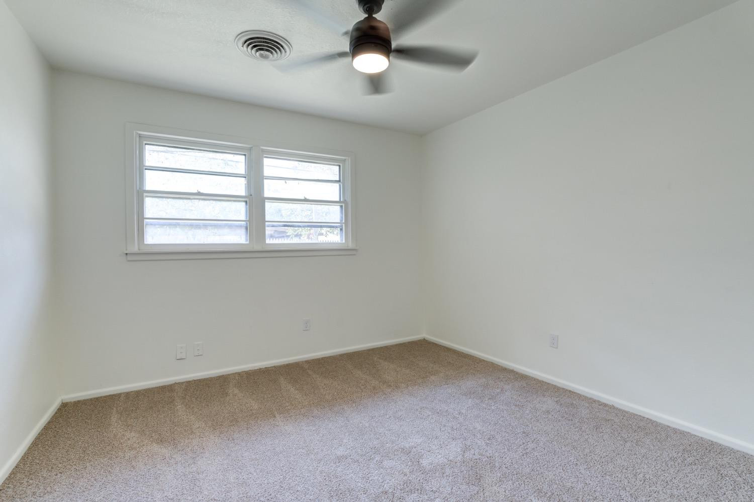 2119 67th Street Lubbock, TX 79412 - Photo 36 of 42 an empty room with a window