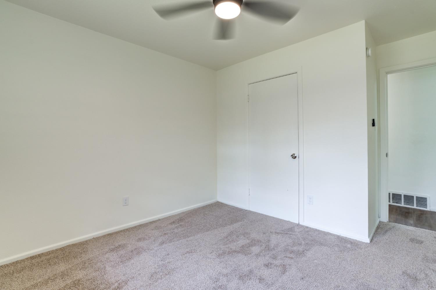 2119 67th Street Lubbock, TX 79412 - Photo 37 of 42 a view of an empty room and a chandelier fan