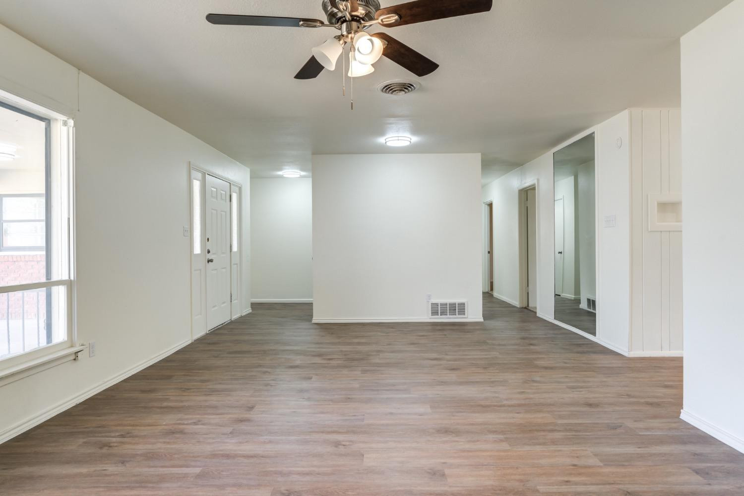 2119 67th Street Lubbock, TX 79412 - Photo 9 of 42 a view of an empty room with a window