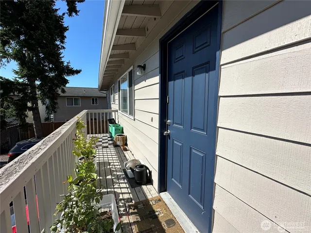 a balcony with wooden floor