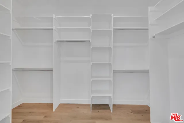 a view of an empty walk in closet
