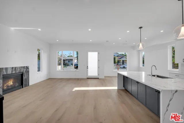 a view of a kitchen and a sink a fireplace