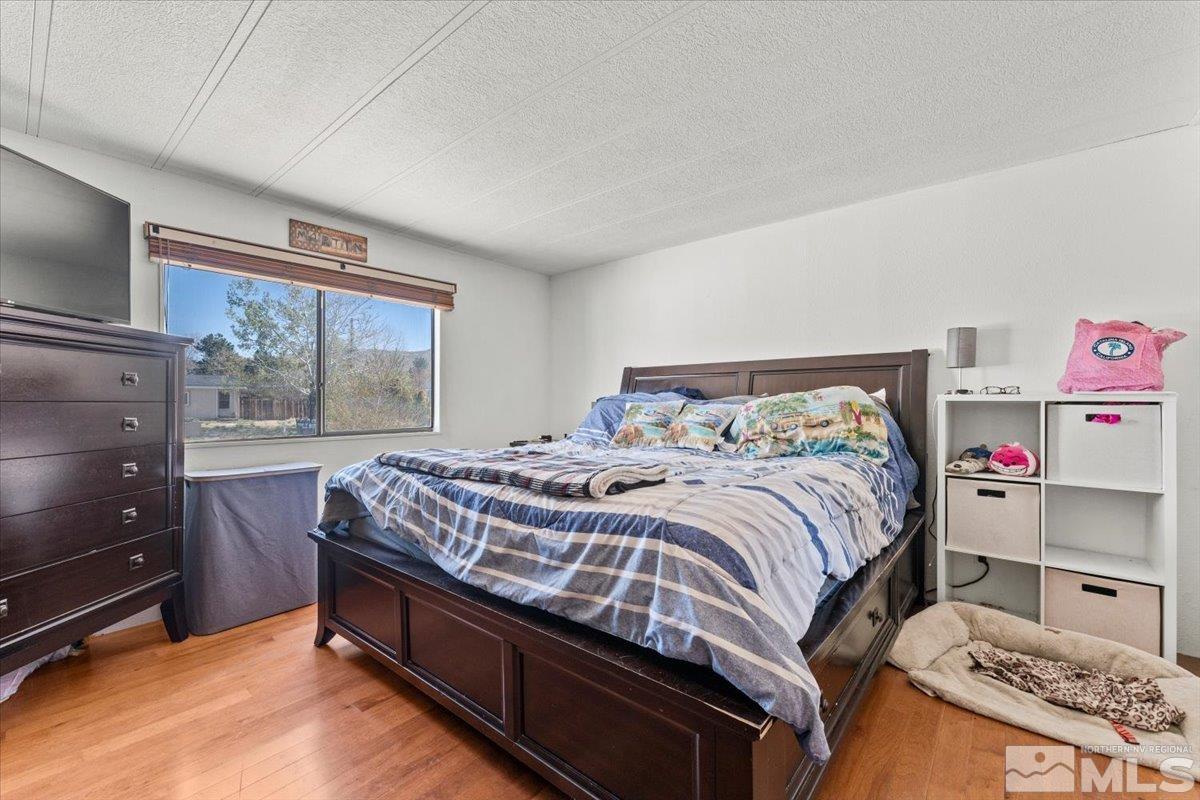 3867 Puffin Street Reno, NV 89508 - Photo 17 of 29 a bedroom with a bed and a window