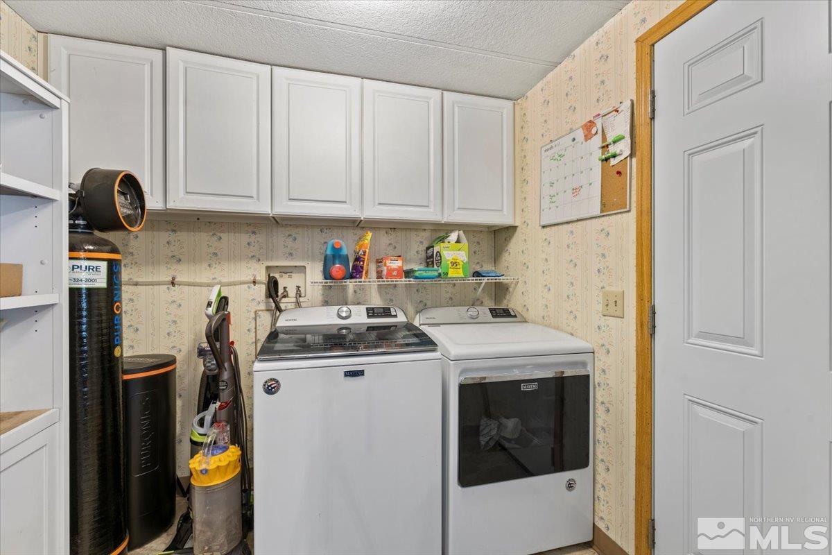 3867 Puffin Street Reno, NV 89508 - Photo 24 of 29 a kitchen with stainless steel appliances granite countertop a stove and a refrigerator