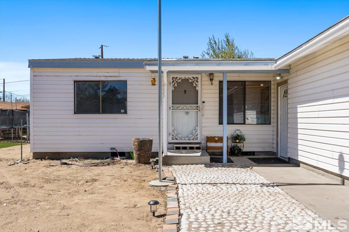 3867 Puffin Street Reno, NV 89508 - Photo 4 of 29 a front view of a house with a yard