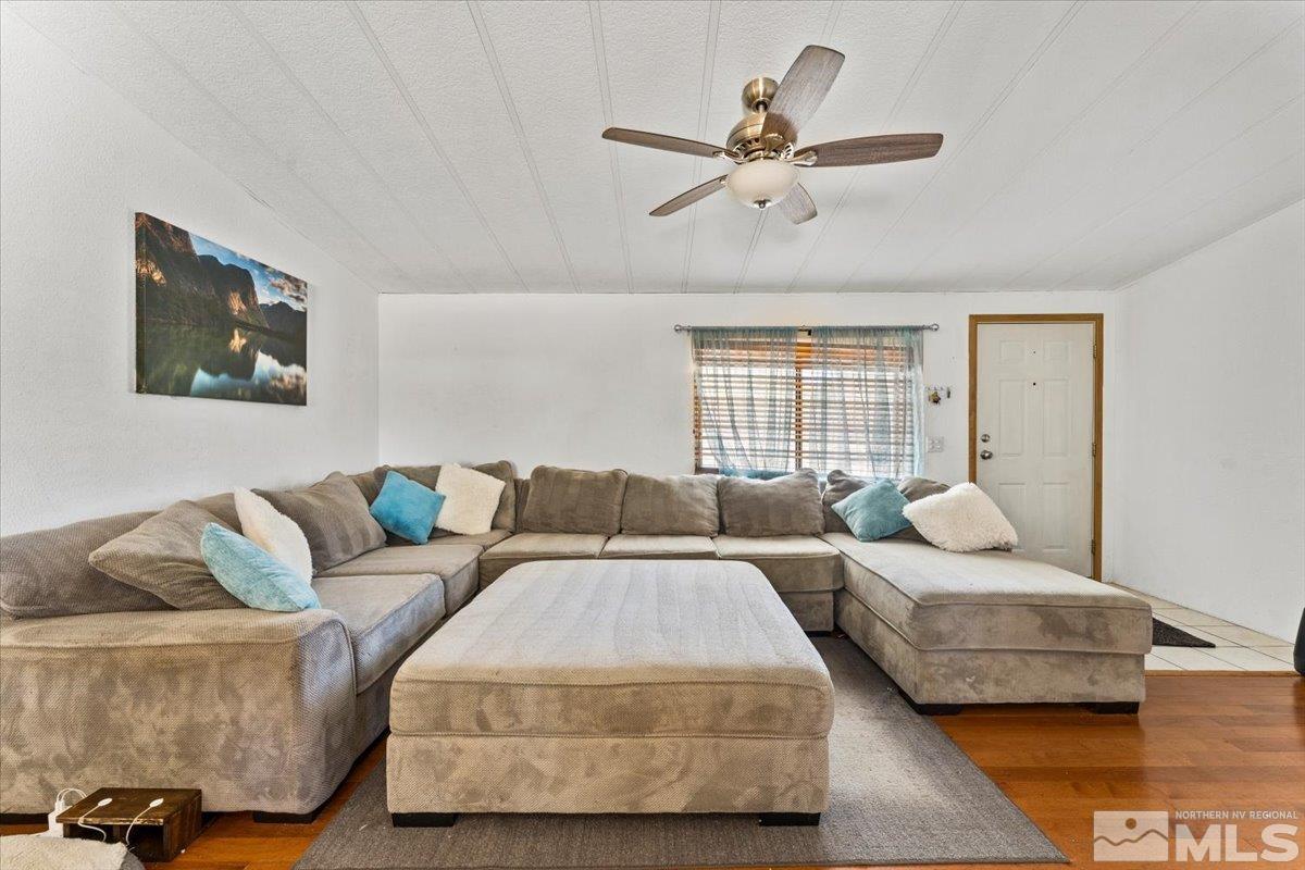3867 Puffin Street Reno, NV 89508 - Photo 8 of 29 a living room with couches and a ceiling fan