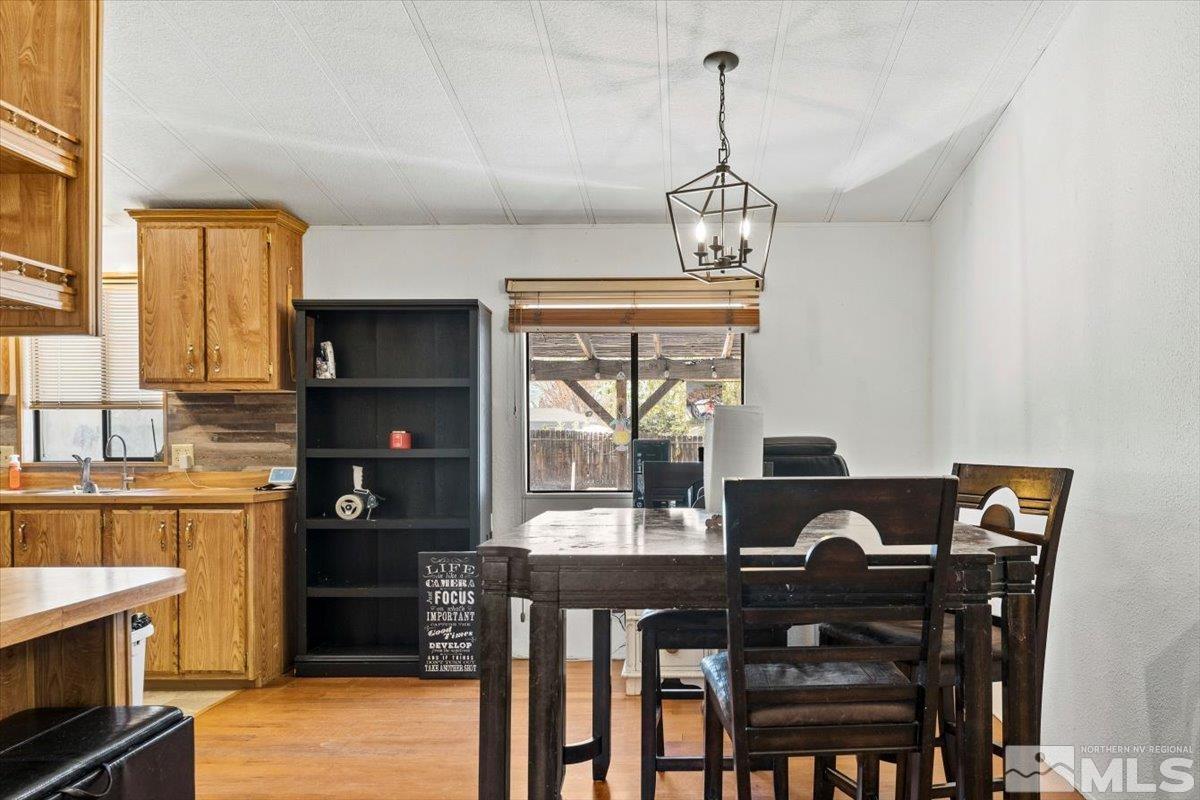 3867 Puffin Street Reno, NV 89508 - Photo 10 of 29 a view of a dining room with furniture window and outside view