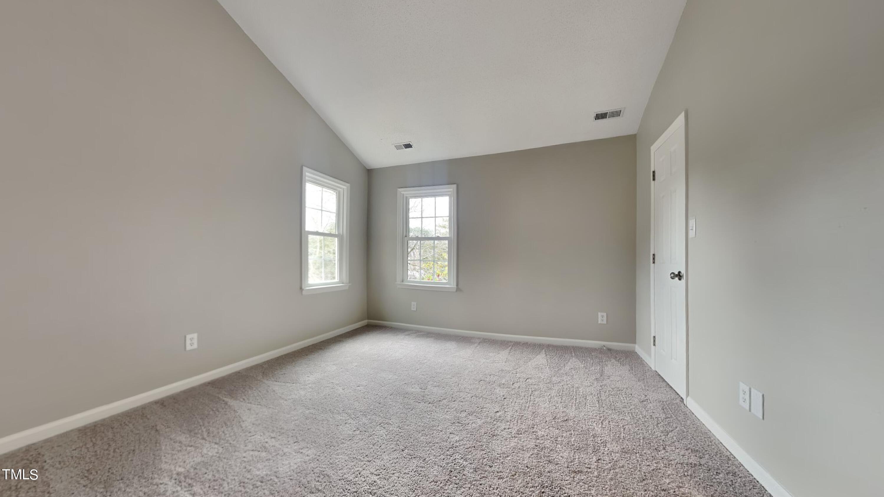 2952 Faversham Place Raleigh, NC 27604 - Photo 4 of 8 a view of an empty room with a window