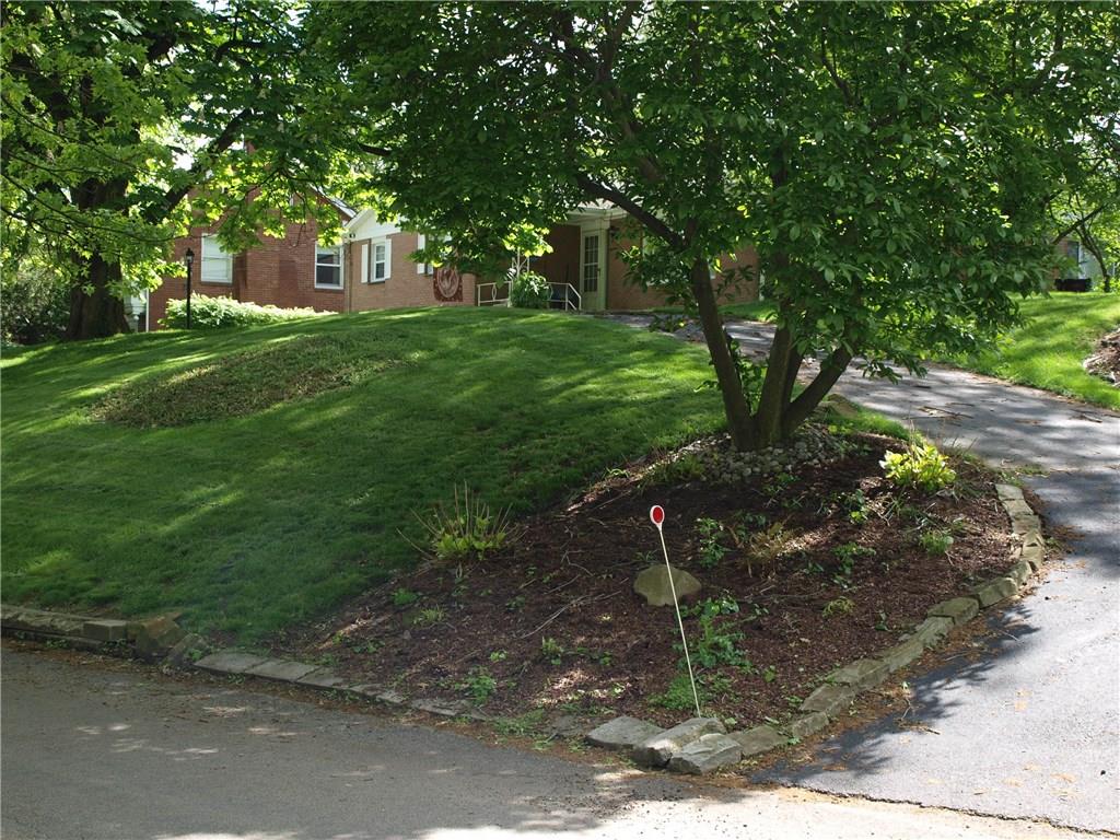 1019 Blackridge Road Pittsburgh, PA 15235 - Photo 19 of 21 A second driveway comes from the side of the yard.
