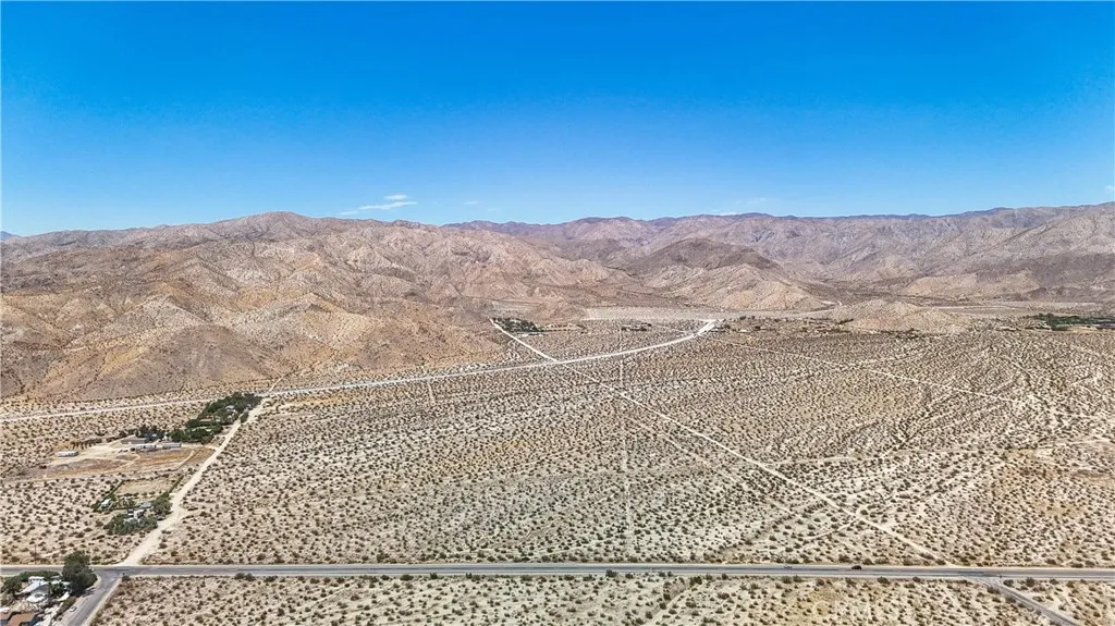 60 Dillon Road Desert Hot Springs, CA 92241 - Photo 8 of 35 a view of a yard with a mountain