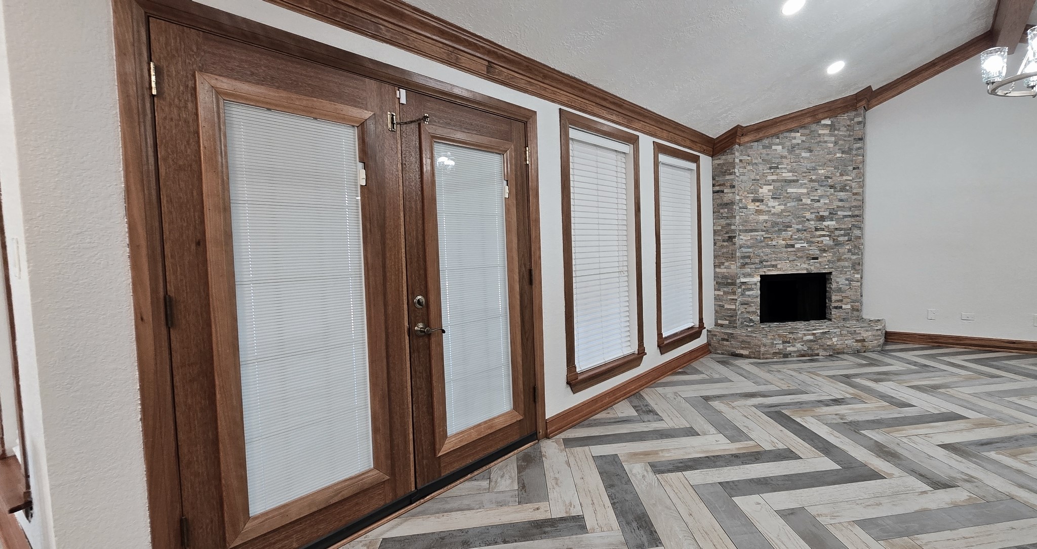 14830 Croxton Drive Houston, TX 77015 - Photo 6 of 38 a view of a livingroom with a fireplace and a hallway