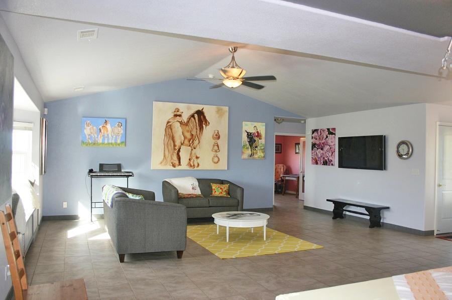 21215 Gyle Road Corning, CA 96021 - Photo 13 of 75 a living room with furniture and a flat screen tv